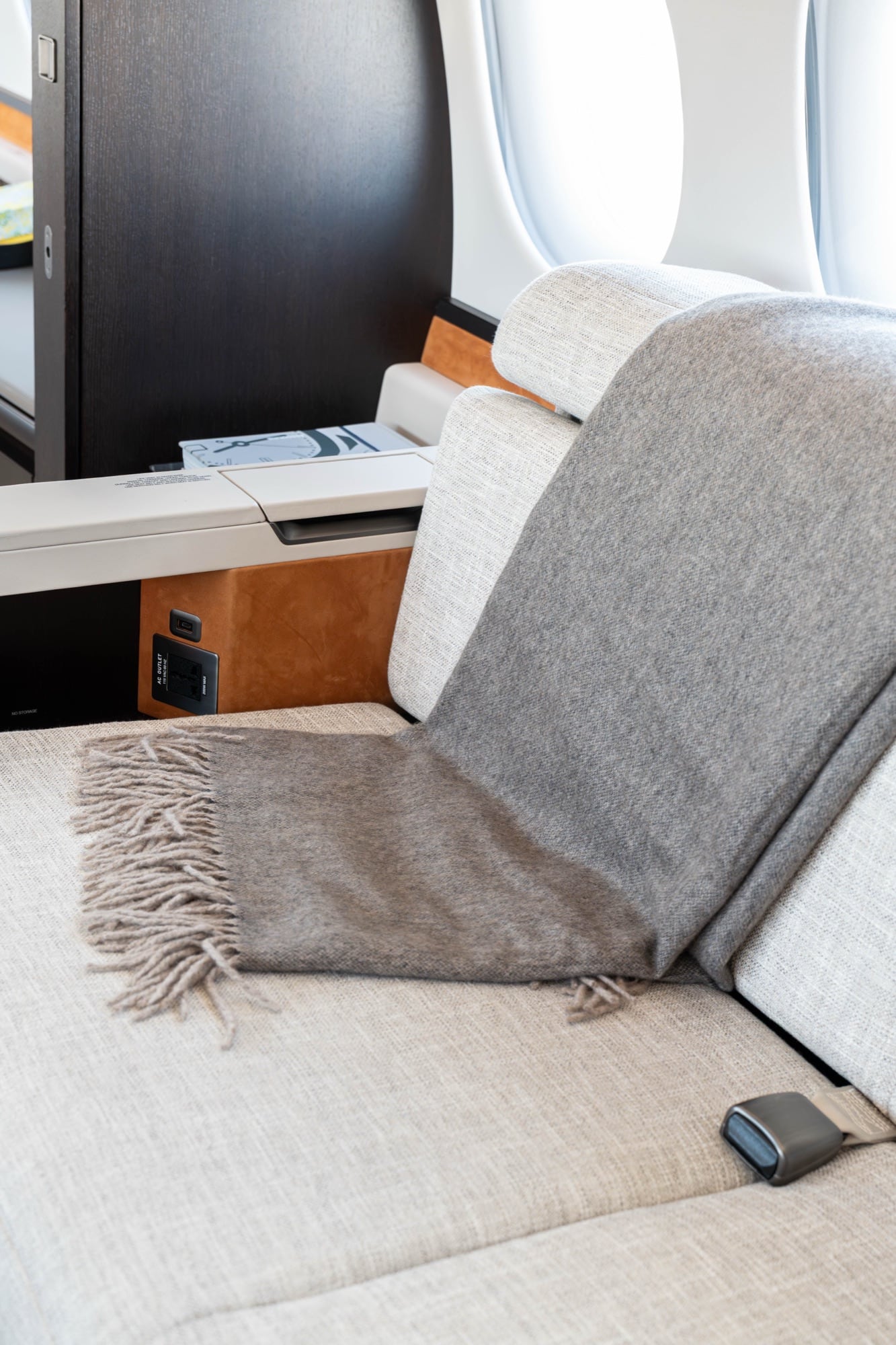 A Falcon 8X divan dressed with a cashmere throw and cushions
