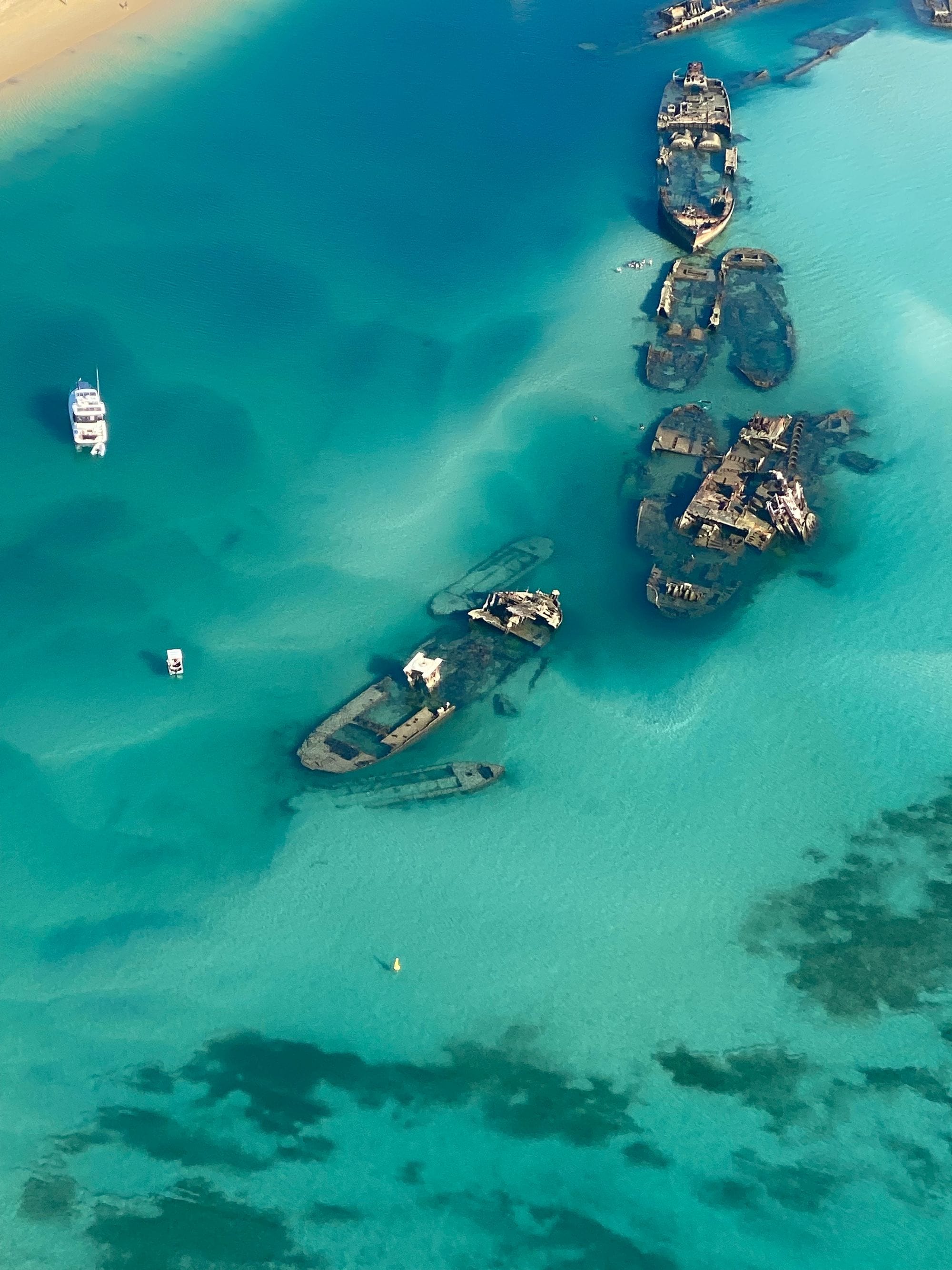 Aerial view of the Tangalooma shipwrecks in turquoise Moreton Bay shallows near Brisbane