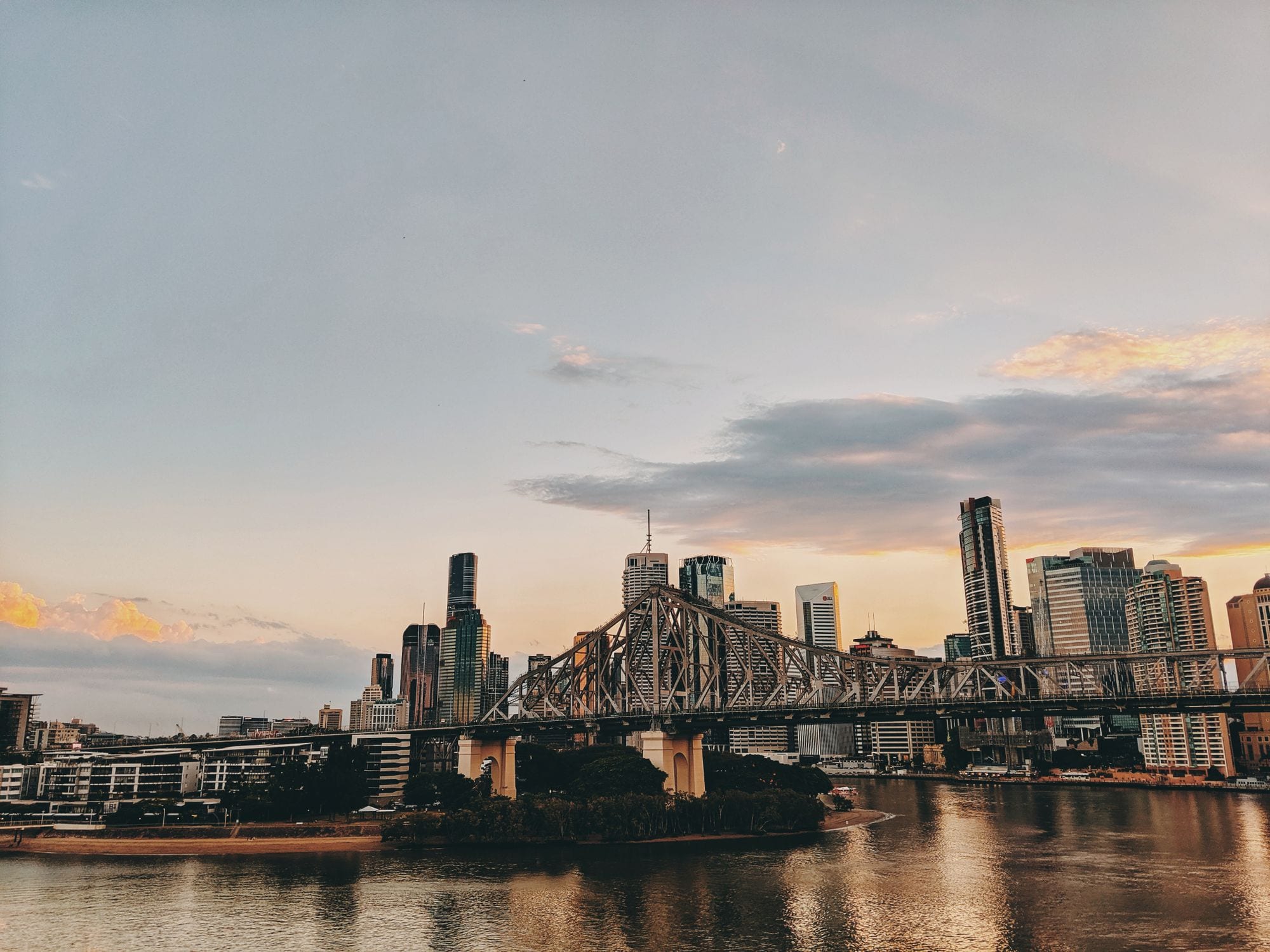 Story Bridge spanning the Brisbane River at twilight under soft pastel skies