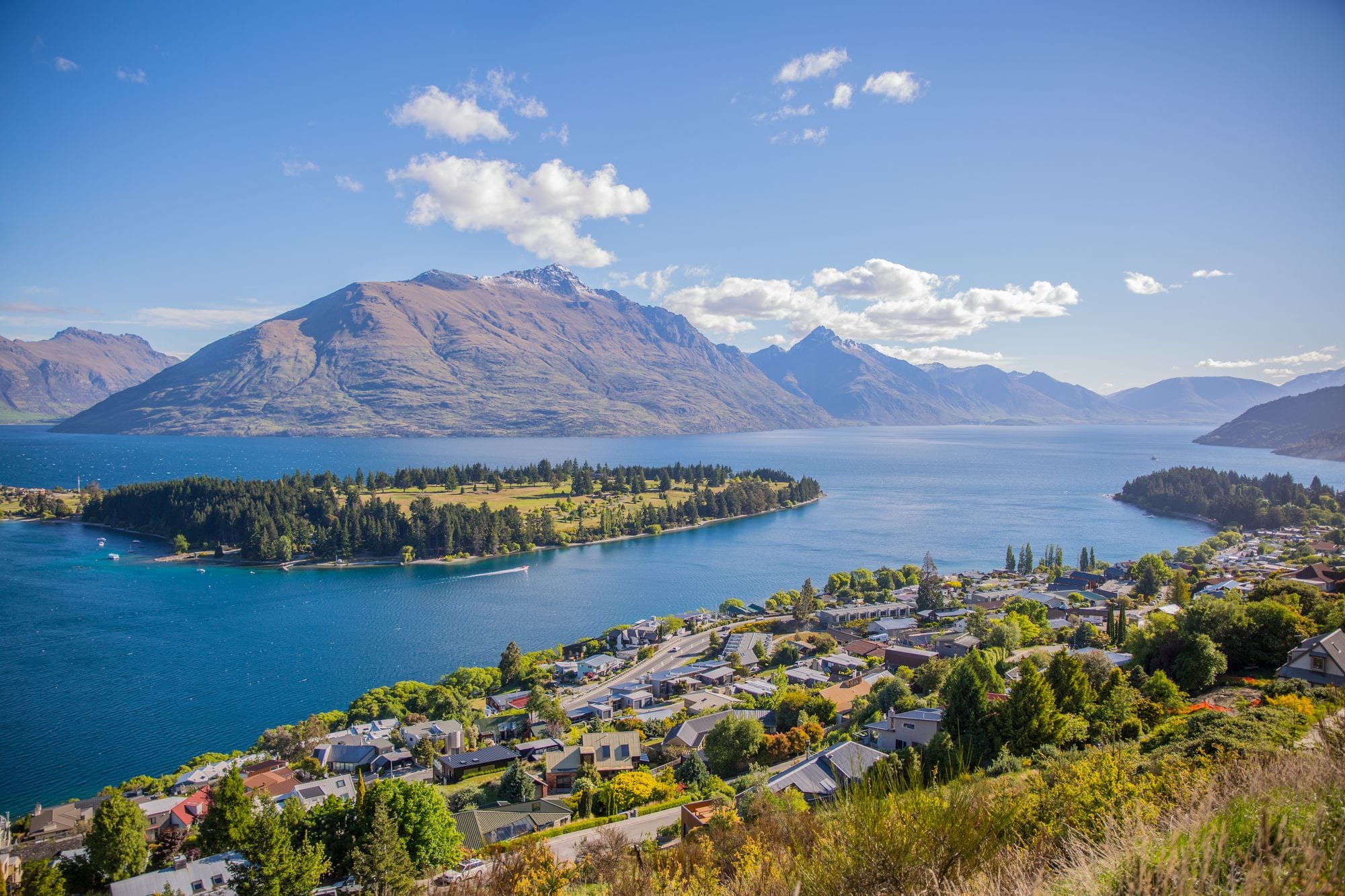 Queenstown and Lake Wakatipu from above, ringed by mountain peaks and the Gardens peninsula