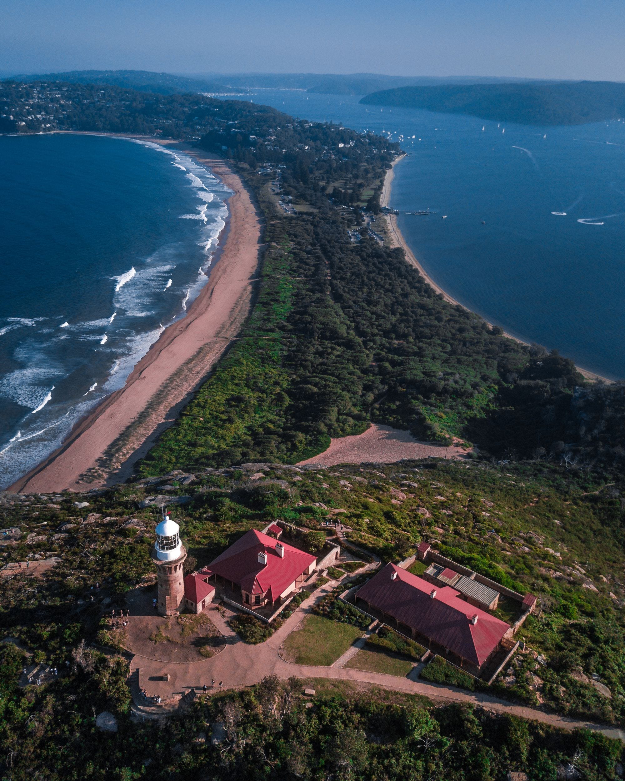 Aerial view of Barrenjoey Lighthouse above Palm Beach and Pittwater on Sydney's northern beaches