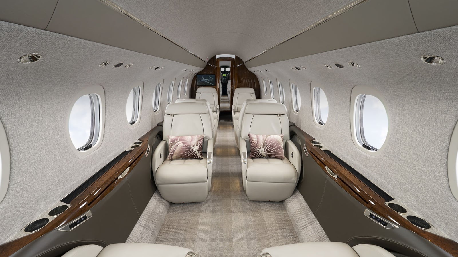The Citation Longitude cabin — double club seating on a flat floor