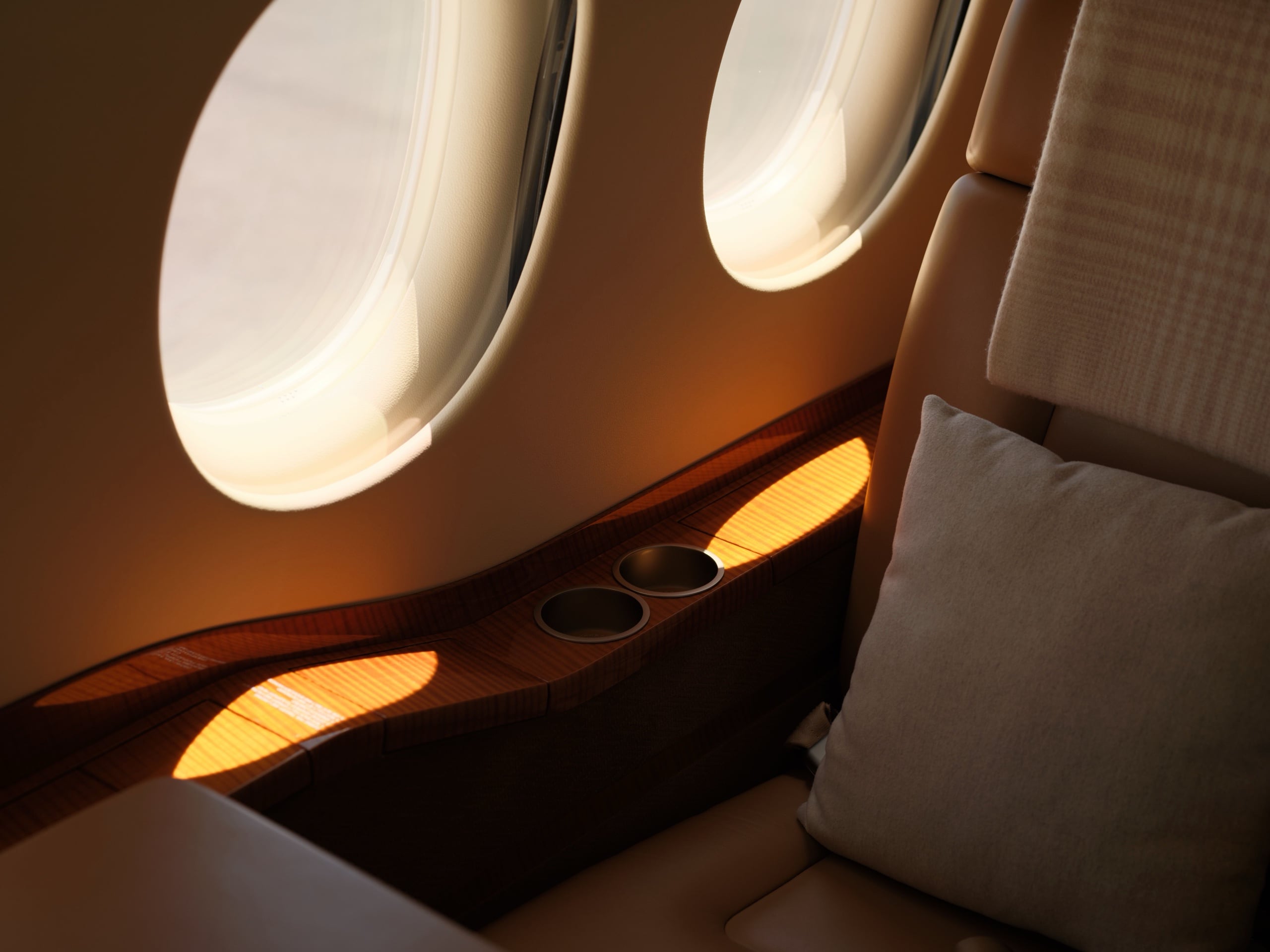 Golden light across a private jet cabin seat and polished walnut sill